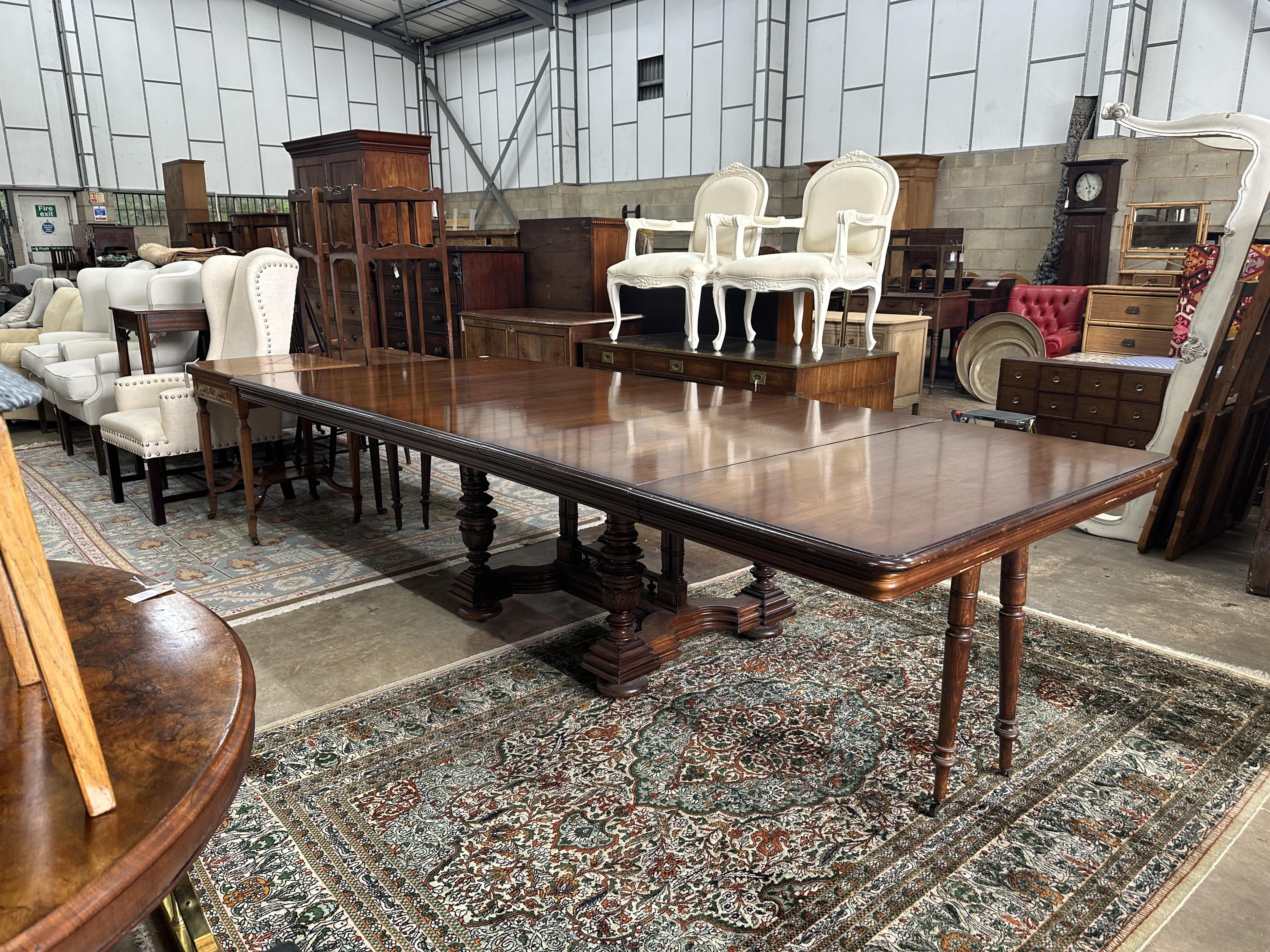 A reproduction French mahogany extending dining table, length 304cm extended, depth 128cm, height 74cm. Condition - good
